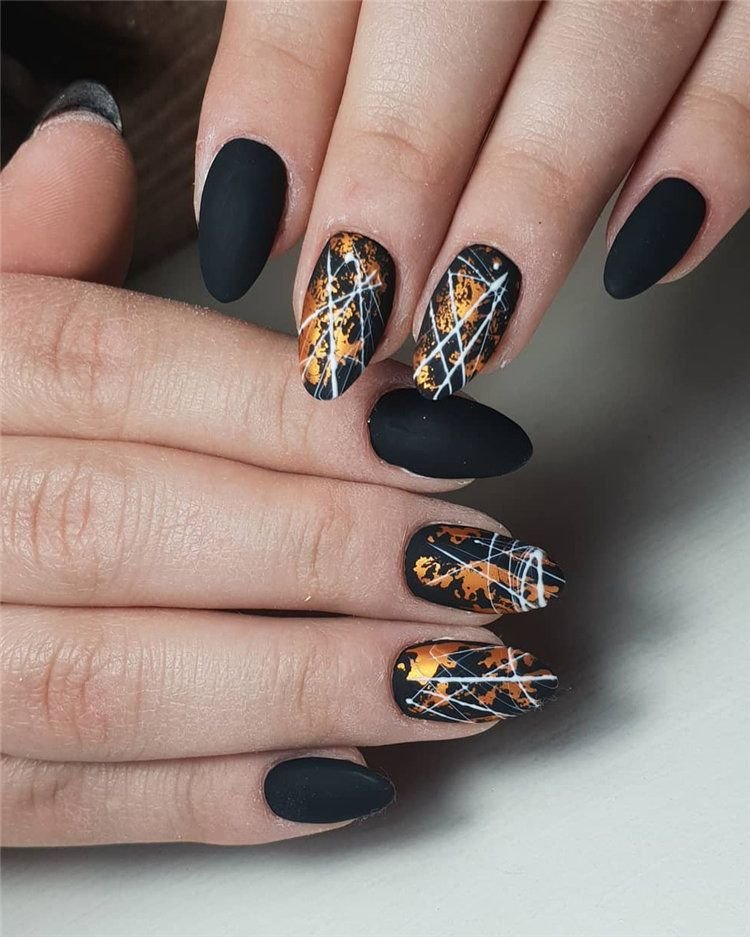 women's black and gold nails