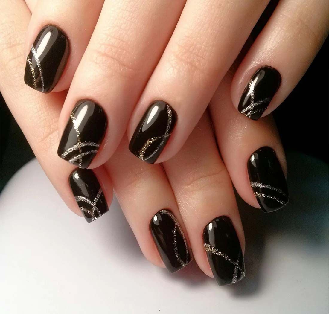 women's black and gold nails