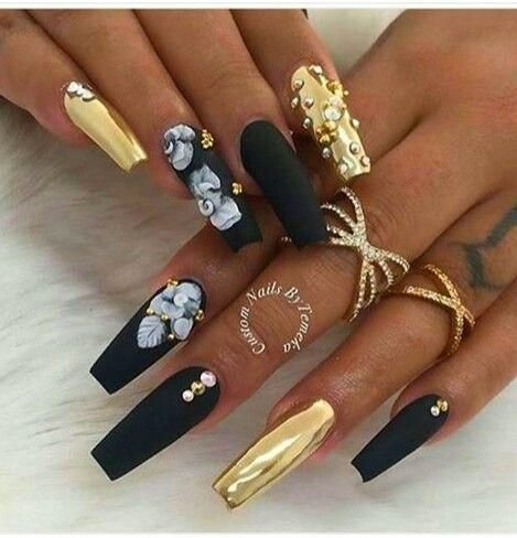 women's black and gold nails