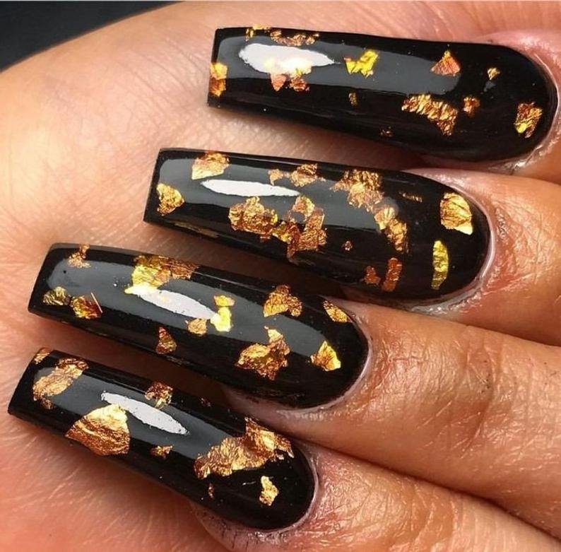 women's black and gold nails