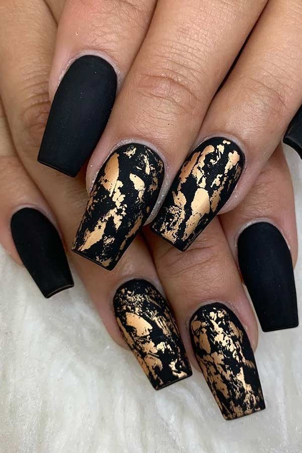 women's black and gold nails