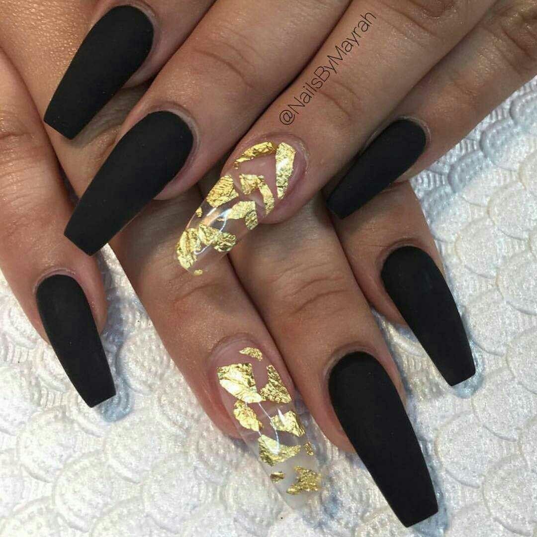 women's black and gold nails