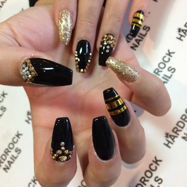 women's black and gold nails